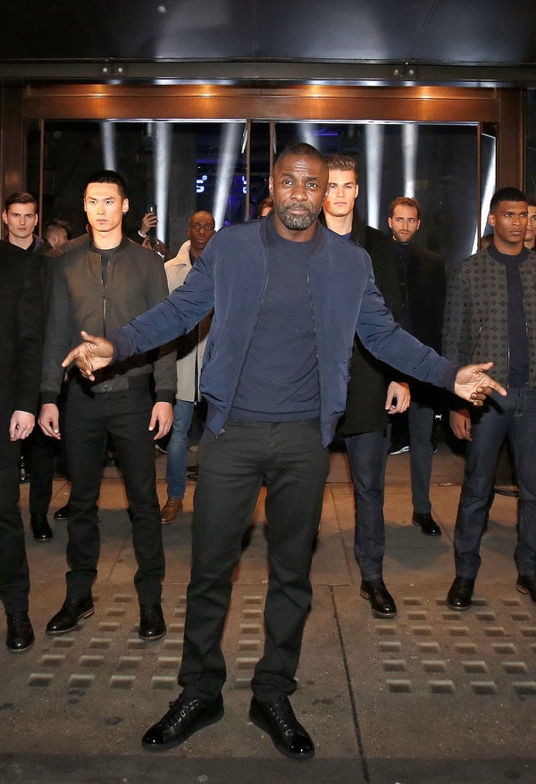 LONDON, ENGLAND - NOVEMBER 26: Idris Elba and models stop traffic as they arrive at Superdry Regent Street to celebrate the launch of the new premium menswear AW15 'Idris Elba + Superdry' collection on November 26, 2015 in London, England. (Photo by David M. Benett/Dave Benett / Getty Images for Superdry)