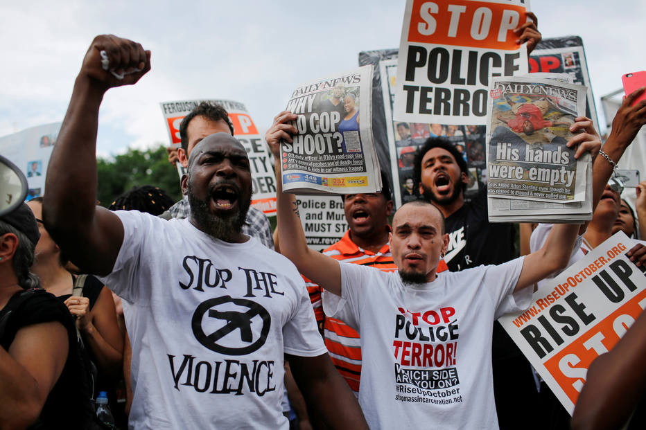 People shout slogans against police as they take part in a protest against the killings of Alton Sterling and Philando Castile during a march in New York July 7, 2016. REUTERS/Eduardo Munoz