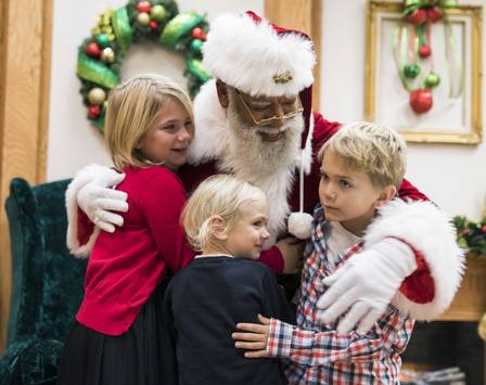 63103011_in-this-thursday-dec-1-2016-photo-larry-jefferson-playing-the-role-of-santa-gets-a-hug